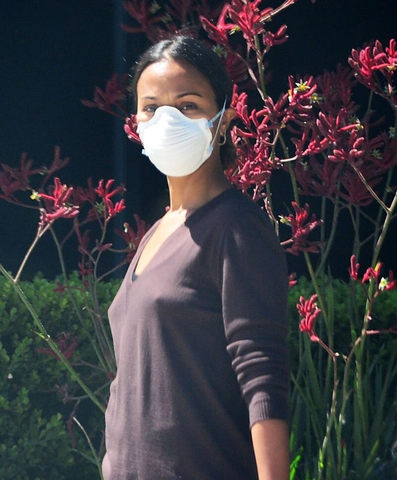 Zoe Saldana braless boobs in a sweater showing off her hard nipples pokies seen by paparazzi out in LA. picture