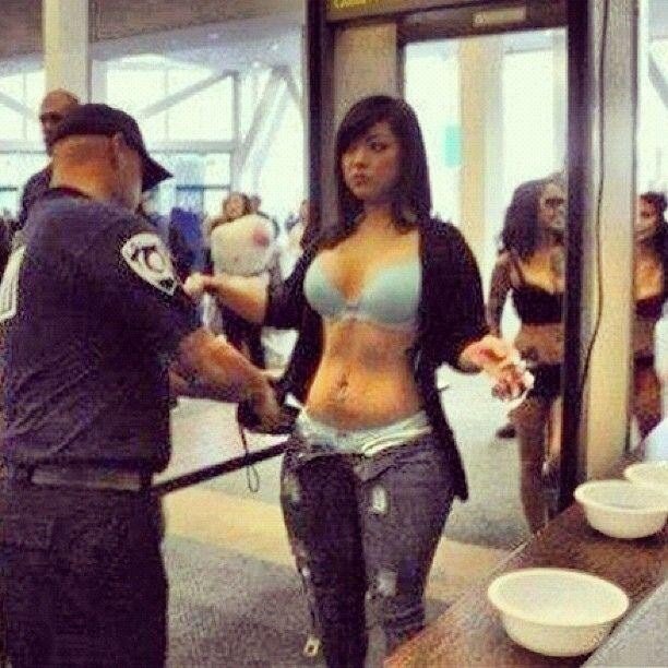 Hottie getting strip searched at the airport. picture