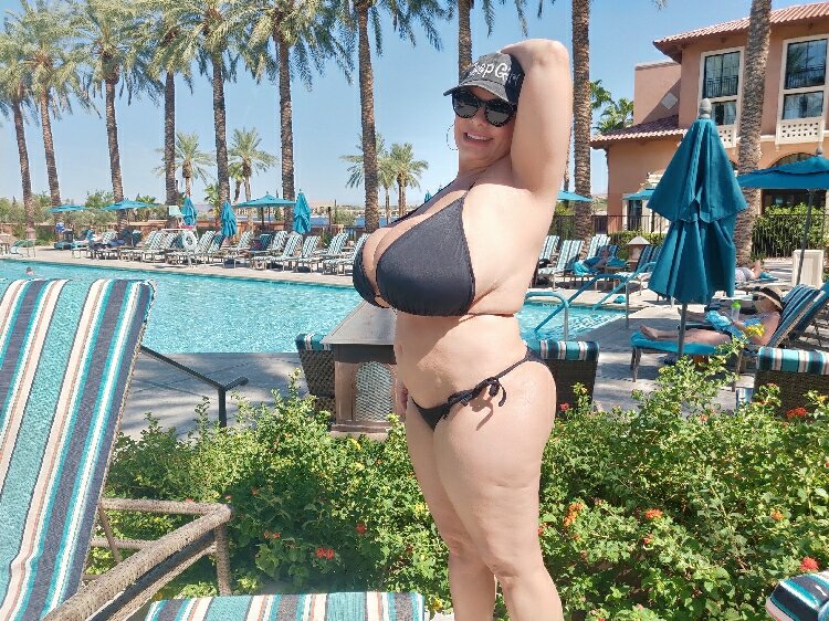 Flesh oozing everywhere from plump Claudia Marie in a bikini at Lake Las Vegas picture