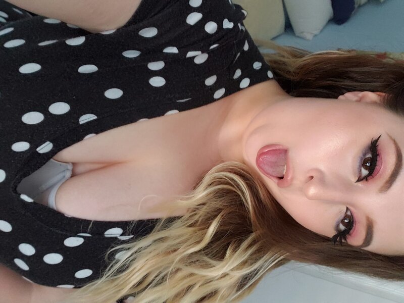 Beautiful Tess teases with tits picture
