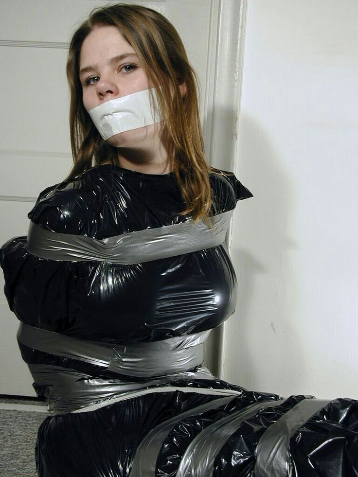 WOMAN bound in a trashbag and wrapped and gagged with tape picture