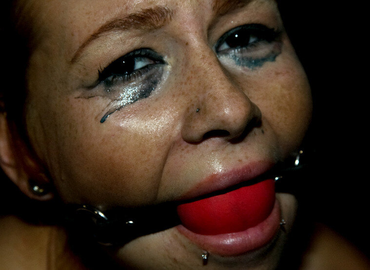 Gorgeous face made better with a tight red hot ball gag! picture