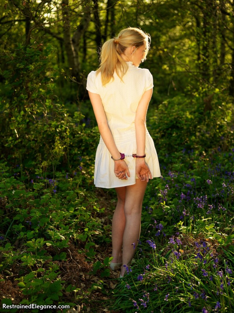 Cute blonde cuffed outdoor picture