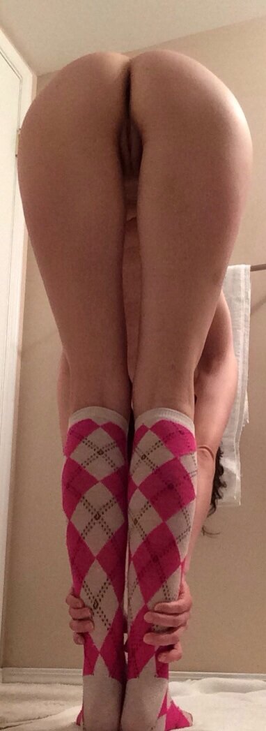 Pink knee-high argyle socks and her pretty pink pussy picture